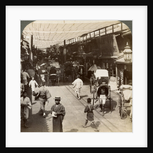 Midsummer traffic under the awnings of Shijo Bashidori, a busy thoroughfare of Kyoto, Japan by Underwood & Underwood