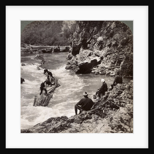 Men on a log raft, shooting the Hozu Rapids on the Katsura River, Kyoto, Japan by Underwood & Underwood