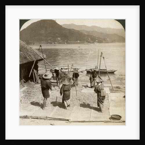 Flailing barley beside a fishing beach on the Inland Sea, Japan by Underwood & Underwood