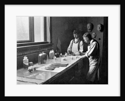 In Professor Herkomer's enamelling studio, grinding colours by Anonymous