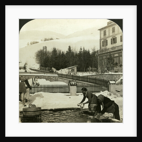 Women washing clothes at the public fountain in midwinter, Zuoz, Switzerland by HC White
