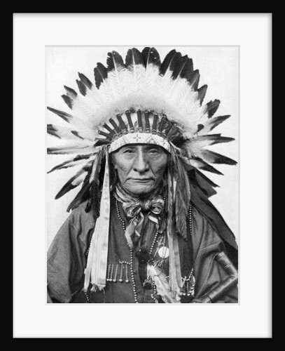 A Native American chief wearing his headdress by Anonymous