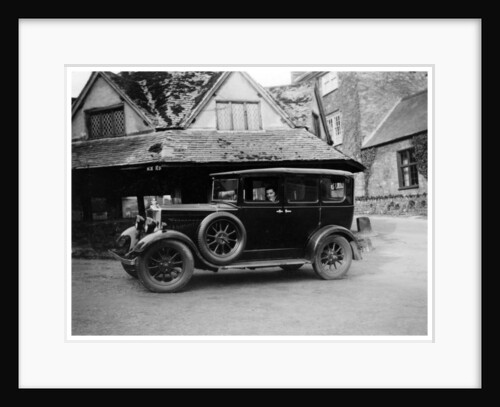 Woman in a vintage car by Anonymous
