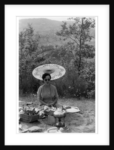Woman under a parasol having a picnic by Anonymous