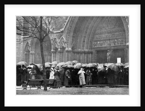 People waiting in the rain in order to attend a service at Westminster Abbey, London by Anonymous