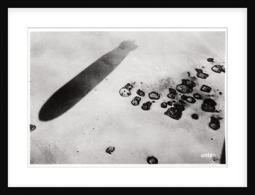 Aerial view of a desert settlement, with a shadow cast by a Zeppelin by Anonymous