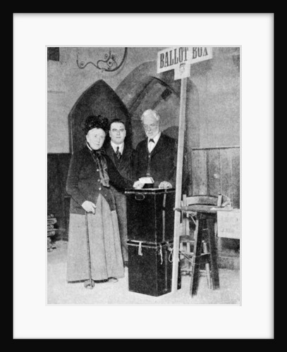 A woman recording her vote at the ballot box by Anonymous