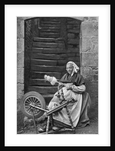 A woman at a spinning wheel, Dinan, Brittany, France by Anonymous