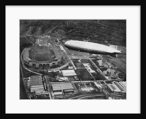 German airship 'Graf Zeppelin' flying over Wembley during the FA Cup Final, London by Central Press