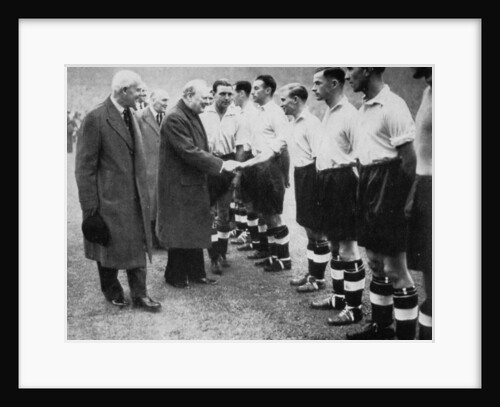 Winston Churchill greets the England football team, Wembley, London, October 1941 by London News Agency