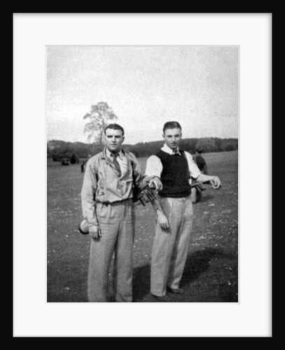 Stanley Matthews and Eddie Hapgood pause between shots during a round of golf by Anonymous