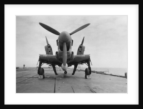 Fairey Firefly aircraft ready to be transported to the hangar lift, HMS Venerable by Anonymous