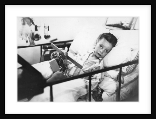 Greek boy from Pylos being nursed in the sick bay of the British battleship HMS Malaya by Anonymous