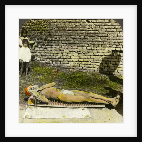 Hindu devotee on a bed of nails near the shrine of Kali, Calcutta, India by Underwood & Underwood