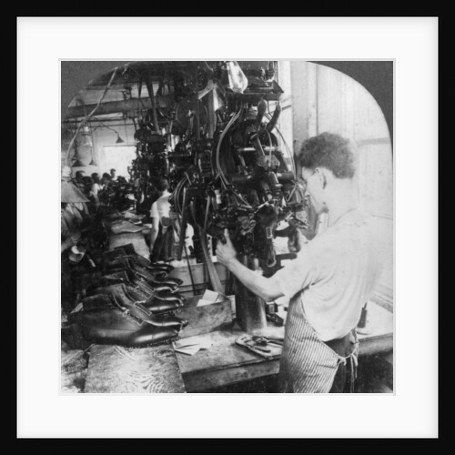 Lasting machine shaping shoes in shoe factory, Lynn, Massachusetts, USA by Keystone View Company