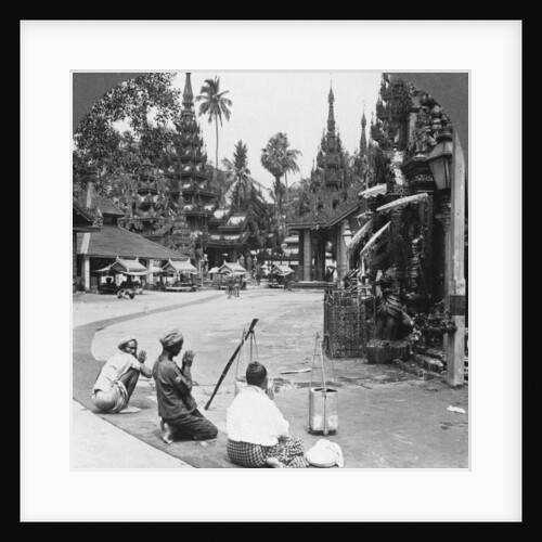 Worshipping before an idol, Shwedagon Pagoda, Rangoon, Burma by Stereo Travel Co