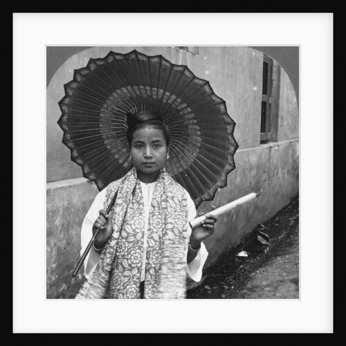 Young Burmese woman holding a huge cigar, Rangoon, Burma by Stereo Travel Co