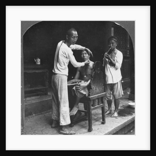 A Chinese barber at Bhamo, Burma by Stereo Travel Co