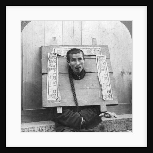 Chinese prisoner in the cangue placarded with the record of his crime by CH Graves