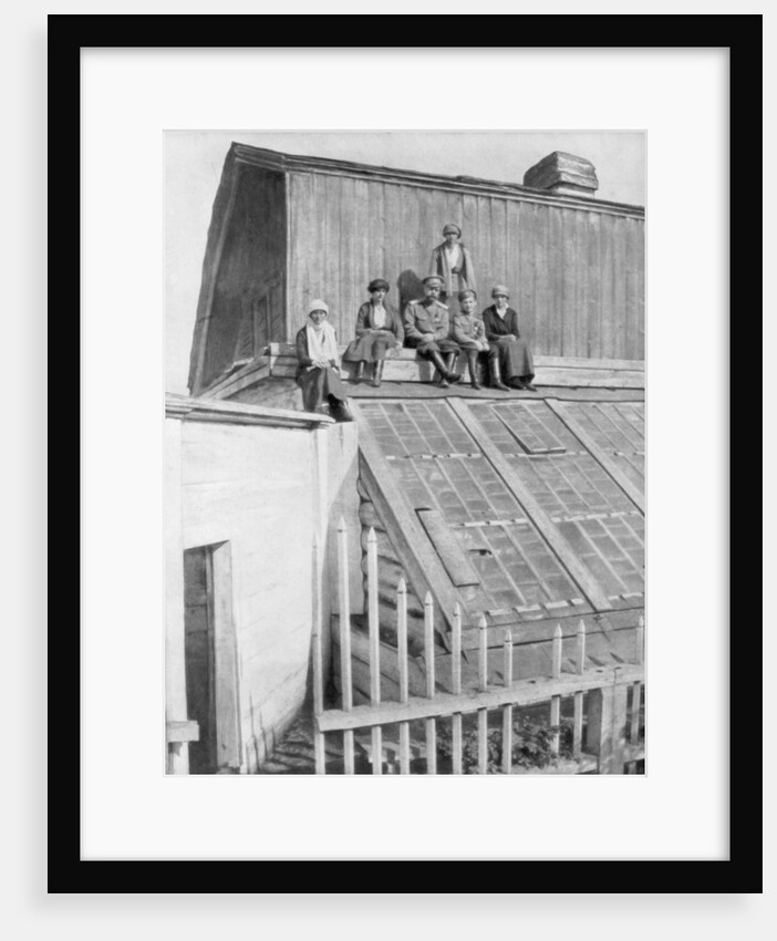 Tsar Nicholas II and his children sitting on a greenhouse, Tobolsk, Siberia, Russia by Anonymous