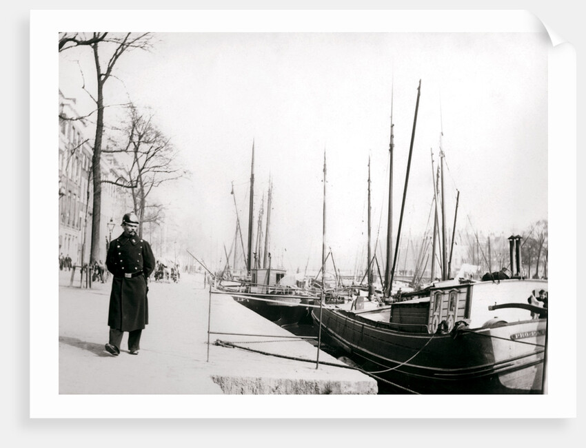 Policeman by a canal, Rotterdam by James Batkin