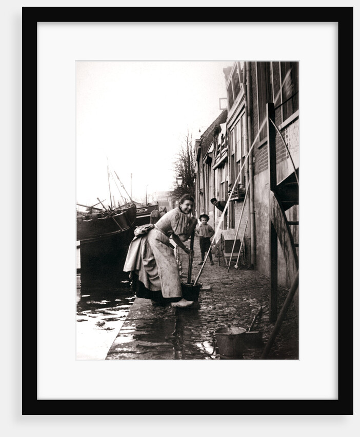 Woman mopping the street, Dordrecht, Netherlands by James Batkin