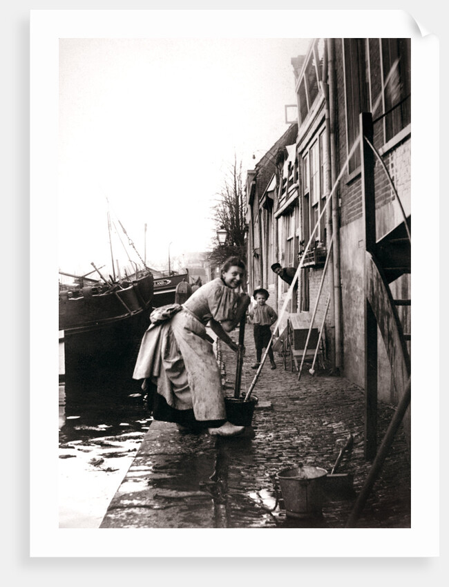Woman mopping the street, Dordrecht, Netherlands by James Batkin