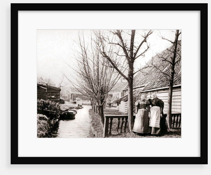 Two women on a canal bank, Broek, Netherlands by James Batkin