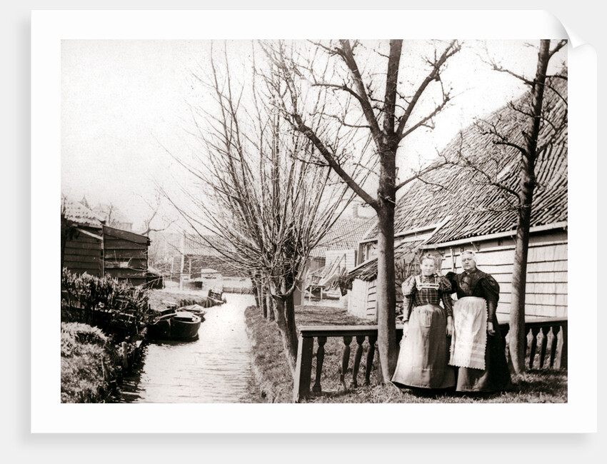 Two women on a canal bank, Broek, Netherlands by James Batkin
