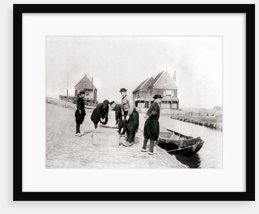 Men and boys in traditional costume by a canal bank, Marken Island, Netherlands by James Batkin