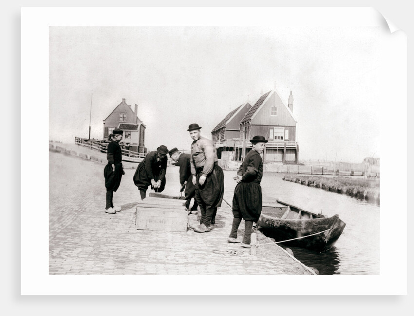 Men and boys in traditional costume by a canal bank, Marken Island, Netherlands by James Batkin