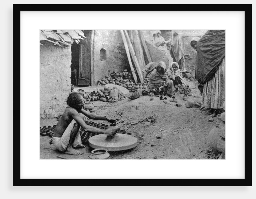 A potter at work, India by Anonymous