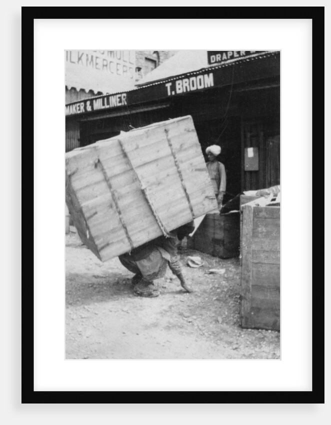 A porter lifting a large load, Chakrata, India by Anonymous