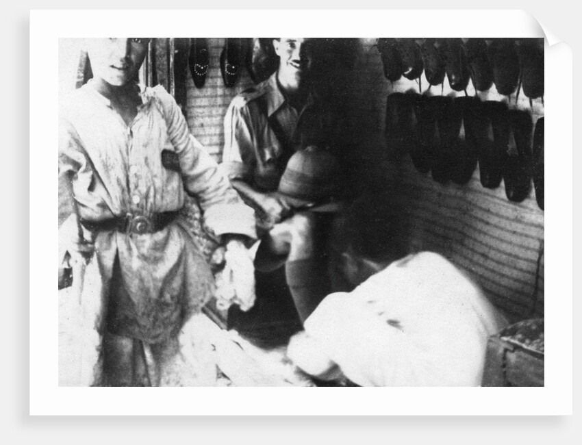 A British officer in a shoe shop, Baghdad, Mesopotamia, WWI by Anonymous