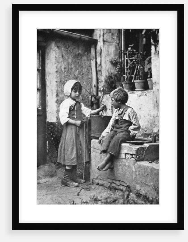 Two children in a backyard by Constance Ellis