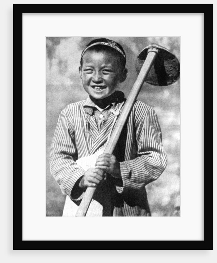 Uzbek schoolboy working on a farm by Anonymous