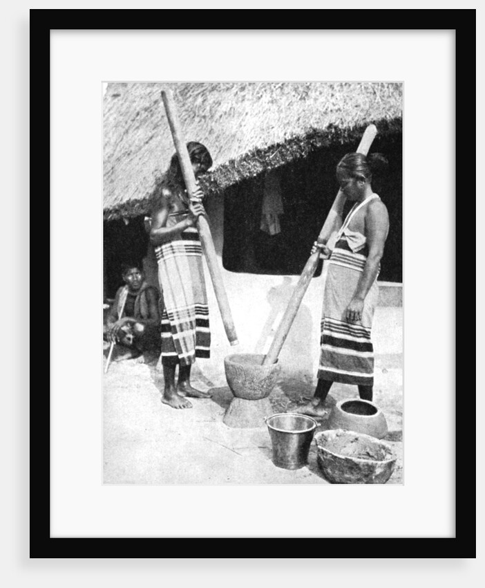 Newar women pounding grain, Nepal by Ewing Galloway