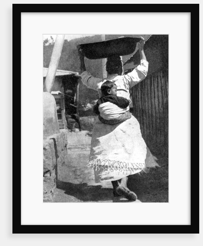 A Korean woman carrying a baby on her back by Wide World Photos