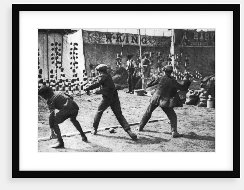 A coconut shy during a bank holiday on Blackheath Common, London by Hall