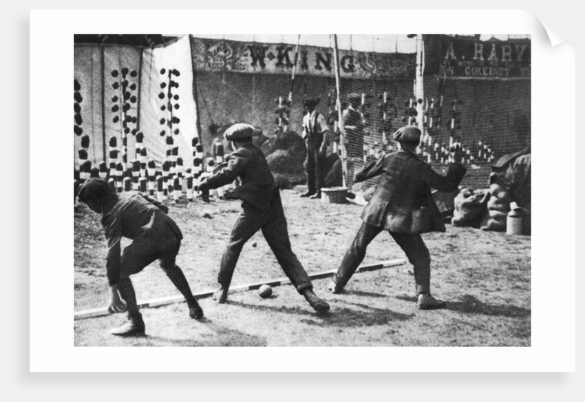 A coconut shy during a bank holiday on Blackheath Common, London by Hall