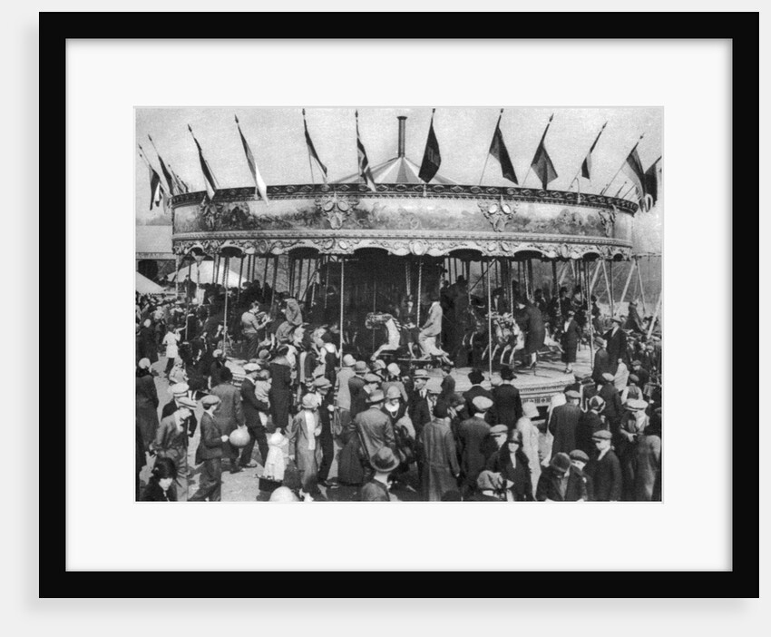 A merry-go-round, part of a bank holiday carnival on Hamstead Heath, London by Anonymous