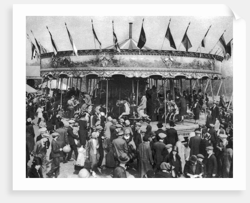 A merry-go-round, part of a bank holiday carnival on Hamstead Heath, London by Anonymous