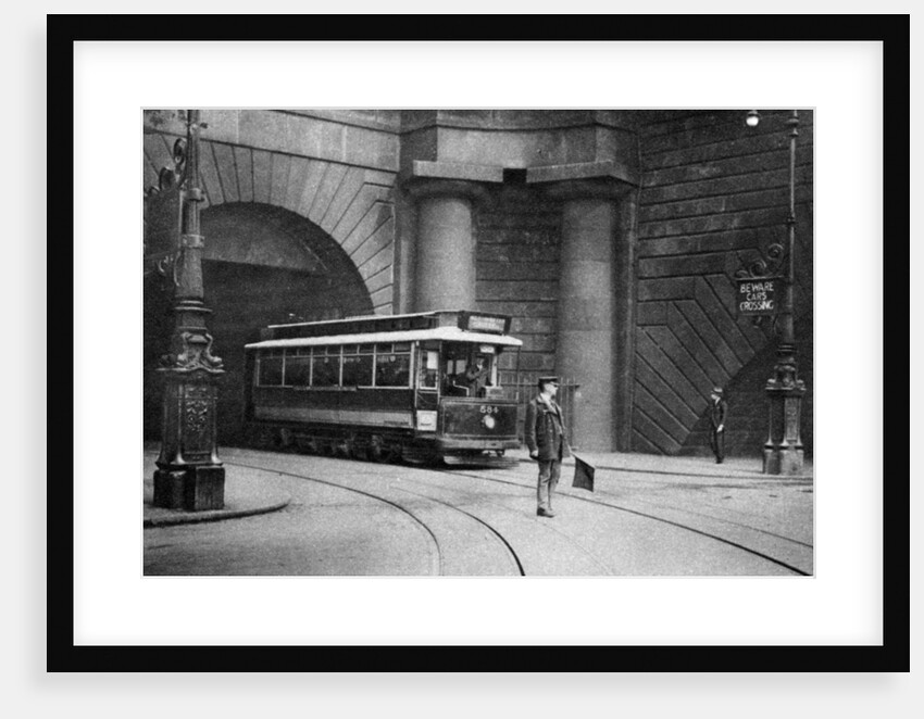 A tram running beneath Kingsway, Aldwych and Somerset House, London by Anonymous
