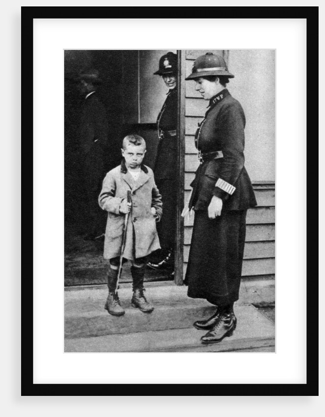 An East End child and a policewoman, London by Anonymous