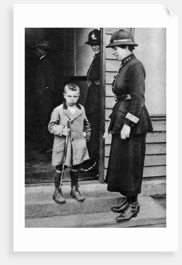 An East End child and a policewoman, London by Anonymous