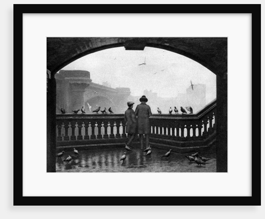 A man and a boy feeding the birds by Blackfriars Bridge, London by Anonymous