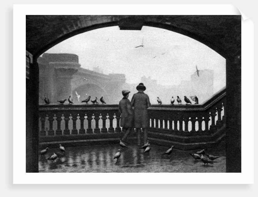A man and a boy feeding the birds by Blackfriars Bridge, London by Anonymous