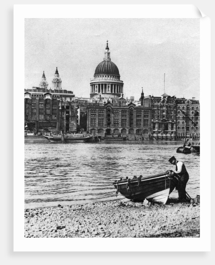 Thames waterman and his boat on the 'beach' at Bankside, London by McLeish