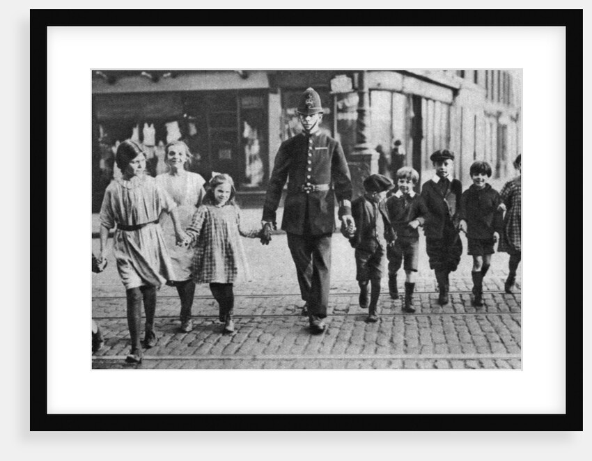 Policeman helping schoolchildren across the road, East End, London by Anonymous