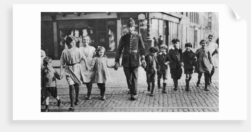Policeman helping schoolchildren across the road, East End, London by Anonymous